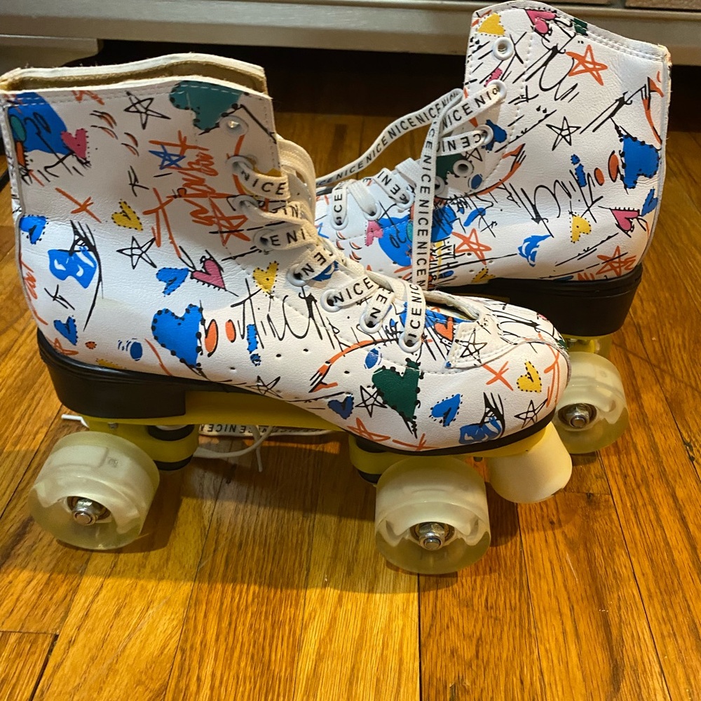 White and multi-coloured high-top roller skates with a funky design #rollerdisco
